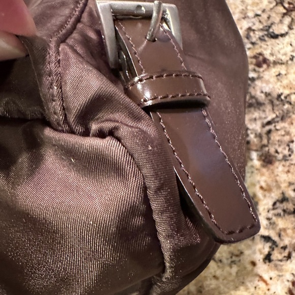 Prada backpack. Pre loved. Brown in color. Pockets inside and outside. - Picture 9 of 12